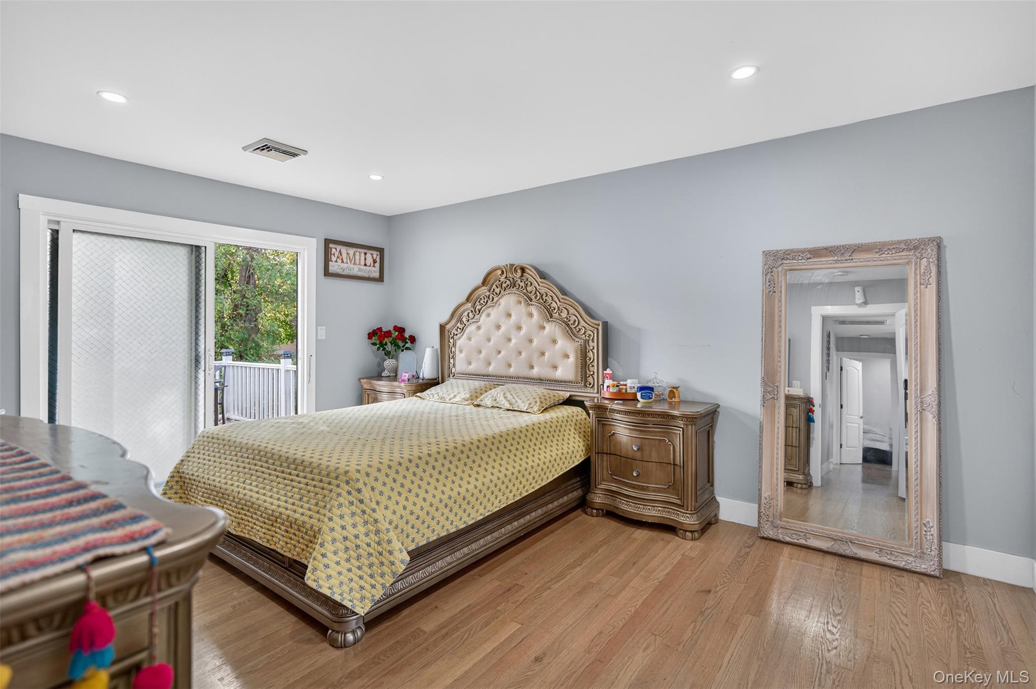 88 Spackenkill Road Poughkeepsie, NY 12603 - Photo 17 of 22 a bedroom with a bed and wooden floor