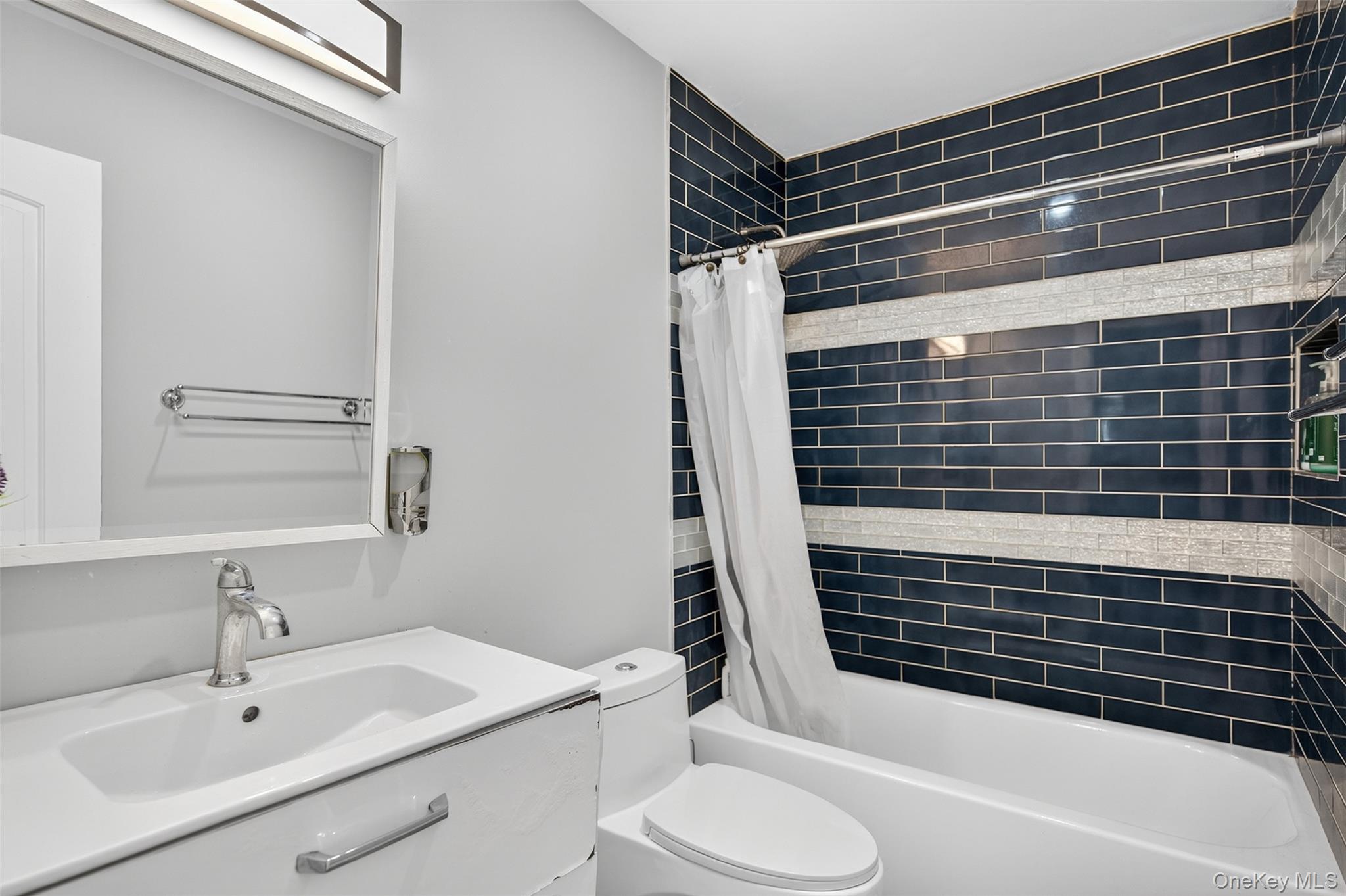 88 Spackenkill Road Poughkeepsie, NY 12603 - Photo 20 of 22 a bathroom with a sink toilet and shower