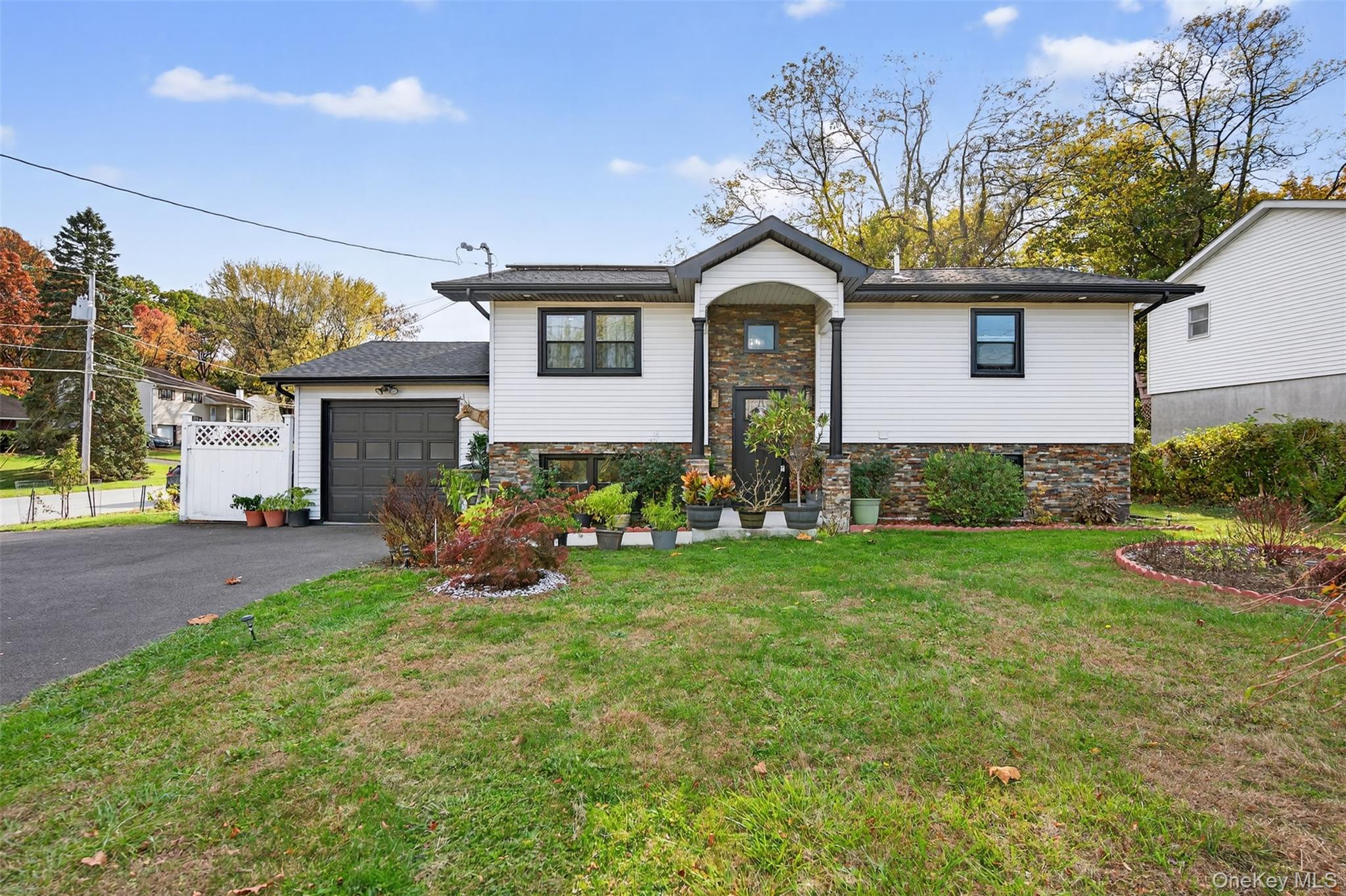 88 Spackenkill Road Poughkeepsie, NY 12603 - Photo 2 of 22 a front view of a house with garden