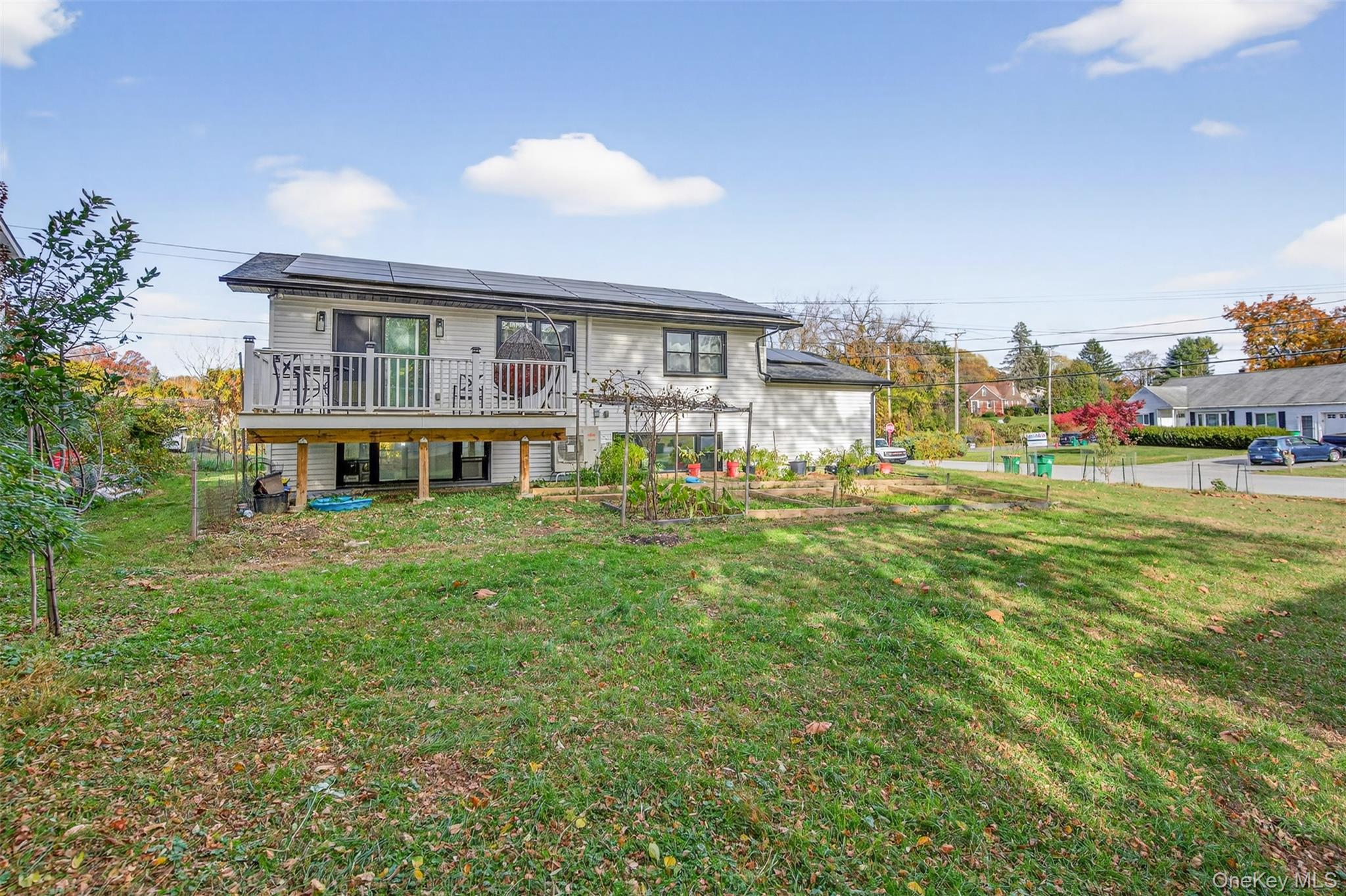 88 Spackenkill Road Poughkeepsie, NY 12603 - Photo 22 of 22 a view of a house with a big yard and large trees