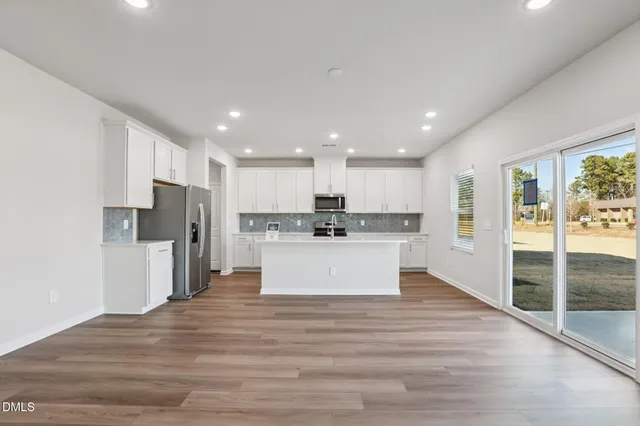 a view of kitchen with wooden floor