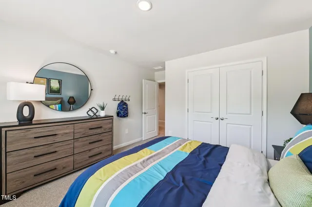 a bed room with a bed and a couch