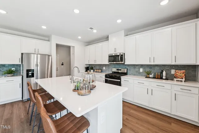 a view of kitchen with dining table and chairs