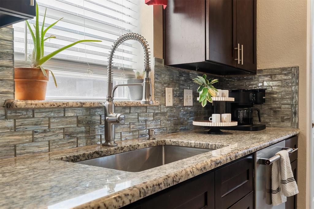 1017 Tanglewood Lane Flower Mound, TX 75028 - Photo 15 of 38 Open sightlines make it easy to stay connected to the action while preparing meals.