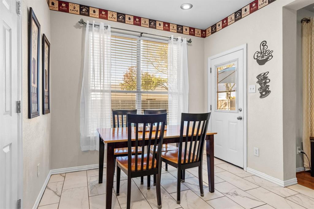 1017 Tanglewood Lane Flower Mound, TX 75028 - Photo 17 of 38 This charming nook is perfect for morning sunlight and relaxed conversations around the table.