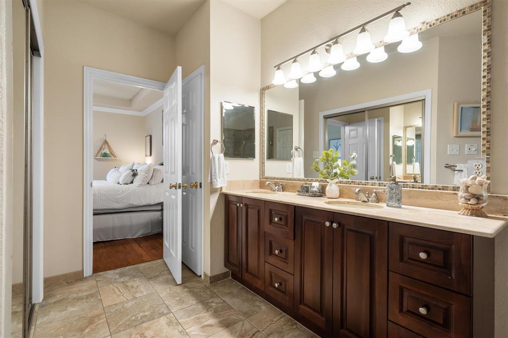 1017 Tanglewood Lane Flower Mound, TX 75028 - Photo 22 of 38 Another refreshed bathroom gives you all the function you need with a clean, timeless look.