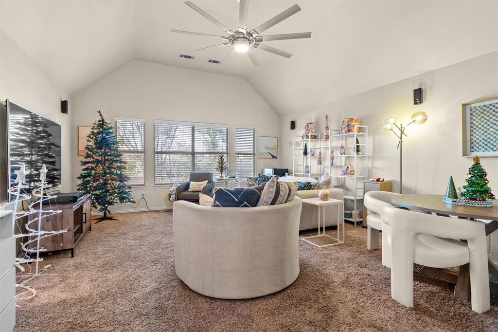 1017 Tanglewood Lane Flower Mound, TX 75028 - Photo 24 of 38 This view captures the warmth and openness that make the living room ideal for everyday living.