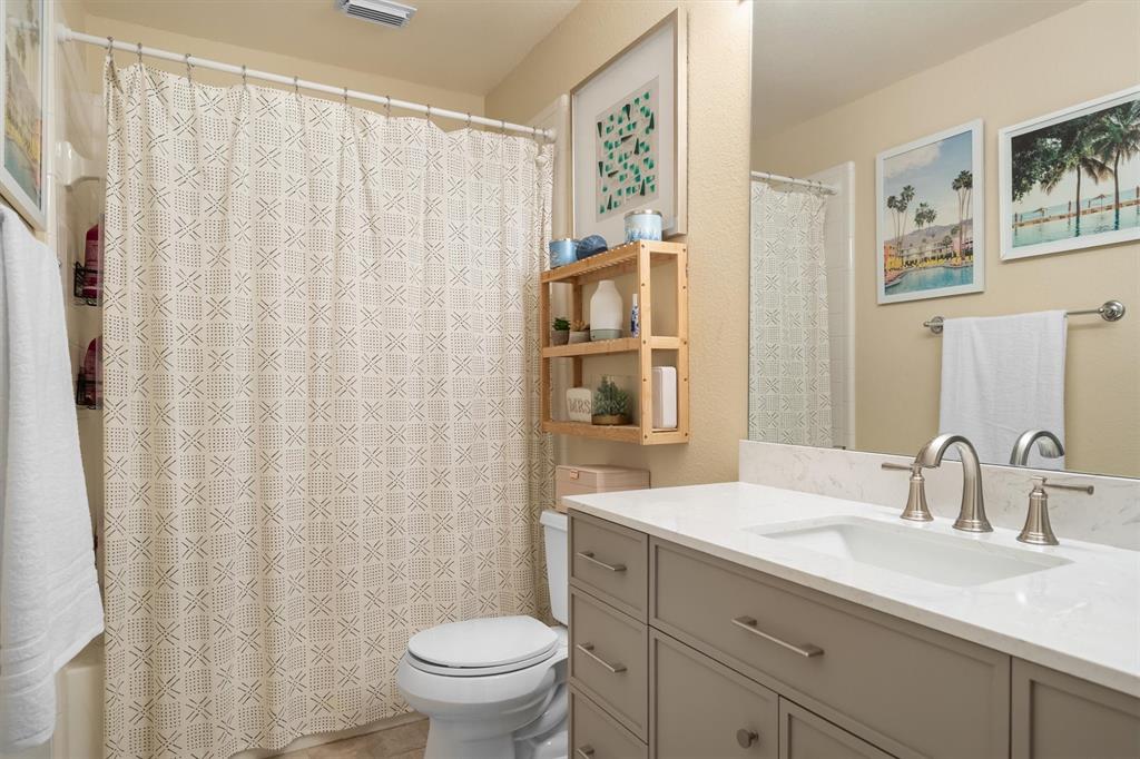 1017 Tanglewood Lane Flower Mound, TX 75028 - Photo 27 of 38 A well-placed bathroom adds convenience for guests and family alike.