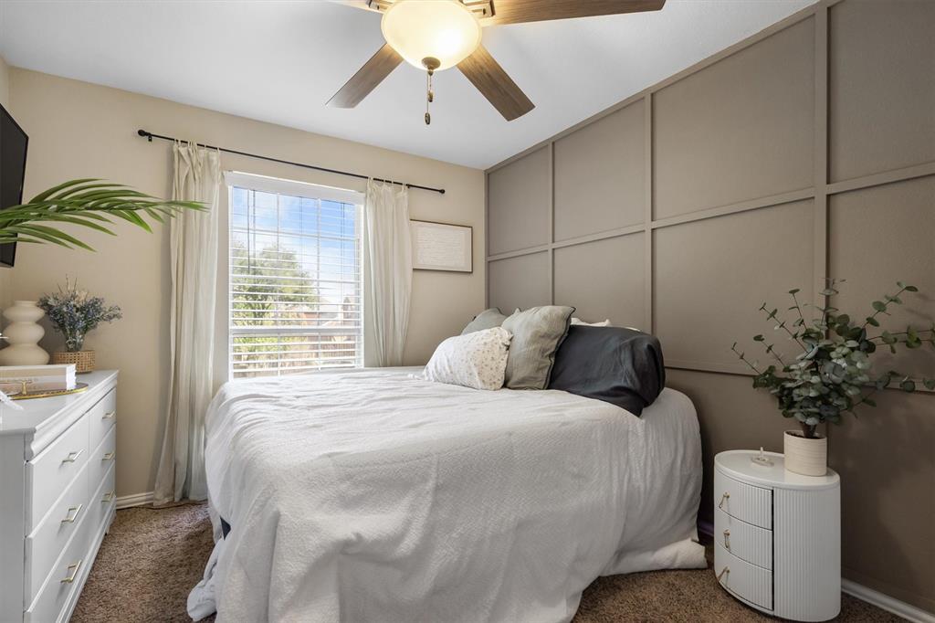 1017 Tanglewood Lane Flower Mound, TX 75028 - Photo 29 of 38 Another spacious bedroom offers comfort for guests or growing families.