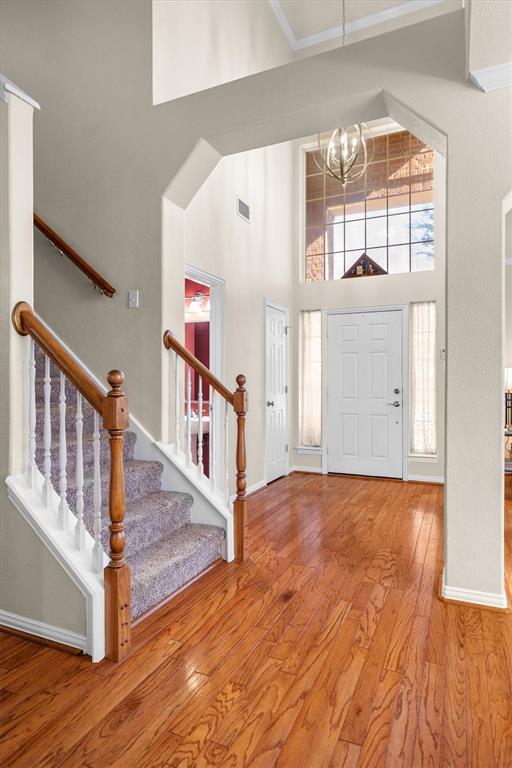 1017 Tanglewood Lane Flower Mound, TX 75028 - Photo 4 of 38 Natural light fills the entry, offering a warm introduction to the home’s easy flow and inviting spaces.