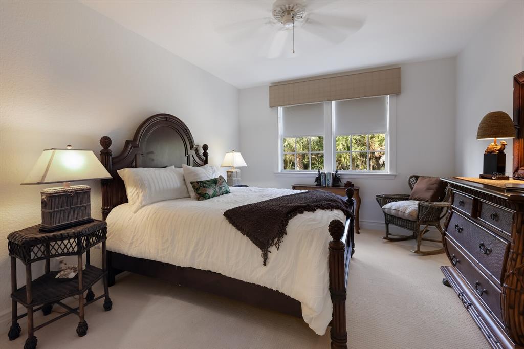 549 Buttonwood Bay Drive Boca Grande, FL 33921 - Photo 21 of 57 a bedroom with a bed and a couch