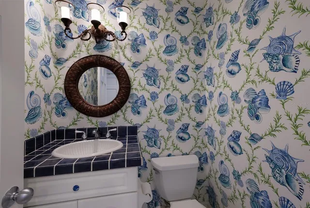 a bedroom with furniture and a large window