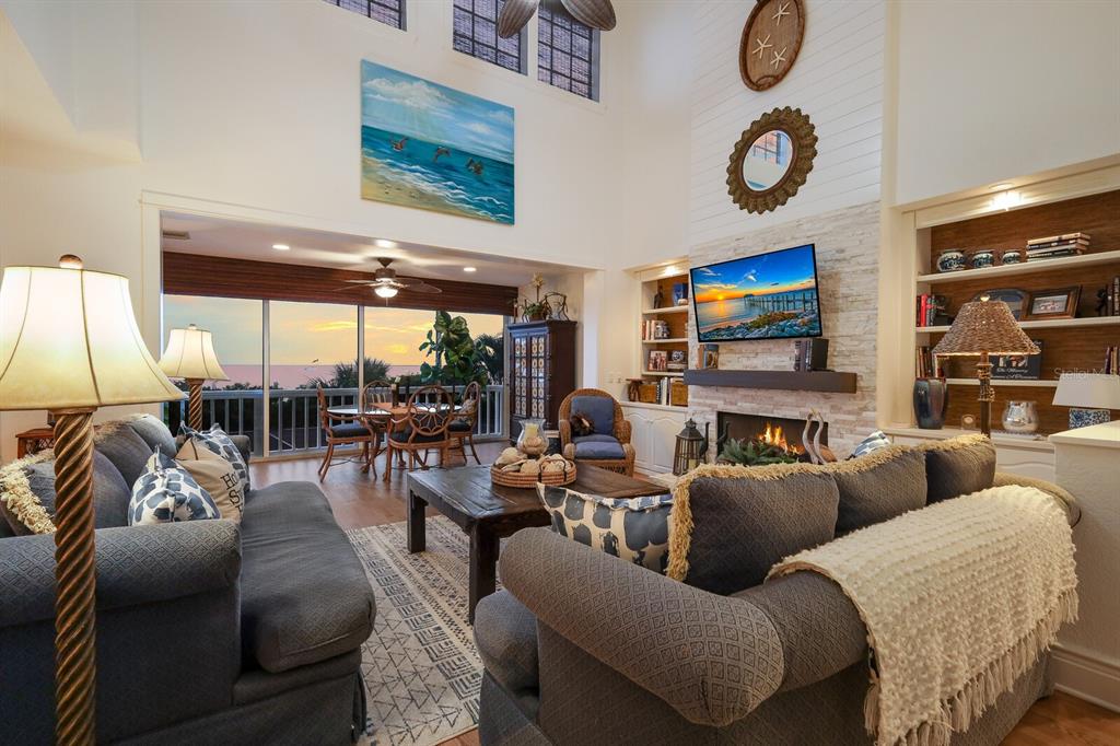 549 Buttonwood Bay Drive Boca Grande, FL 33921 - Photo 3 of 57 a living room with furniture and a flat screen tv