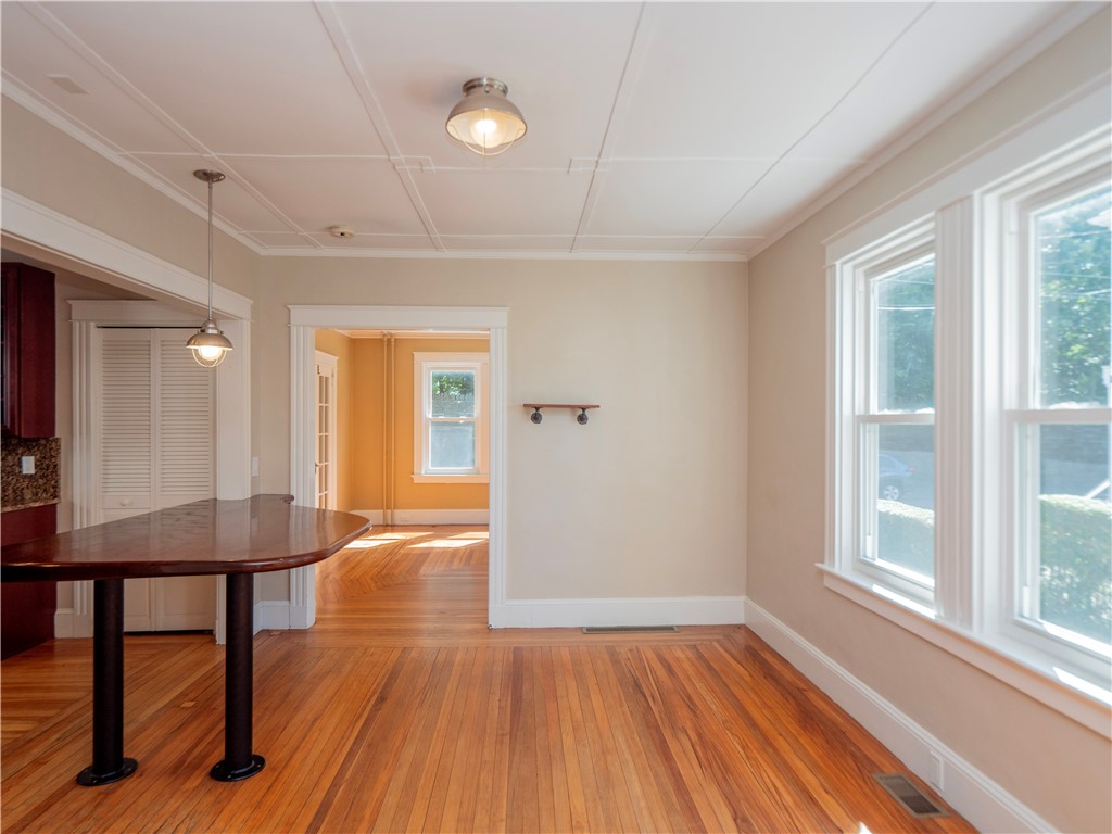 573 Spring Street Newport, RI 02840 - Photo 13 of 50 Dining area view to wooden kitchen island & living room