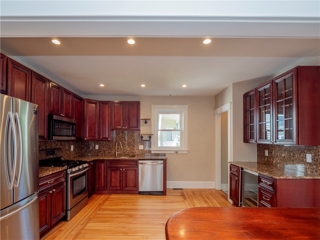 573 Spring Street Newport, RI 02840 - Photo 16 of 50 Dining area view to kitchen over the island