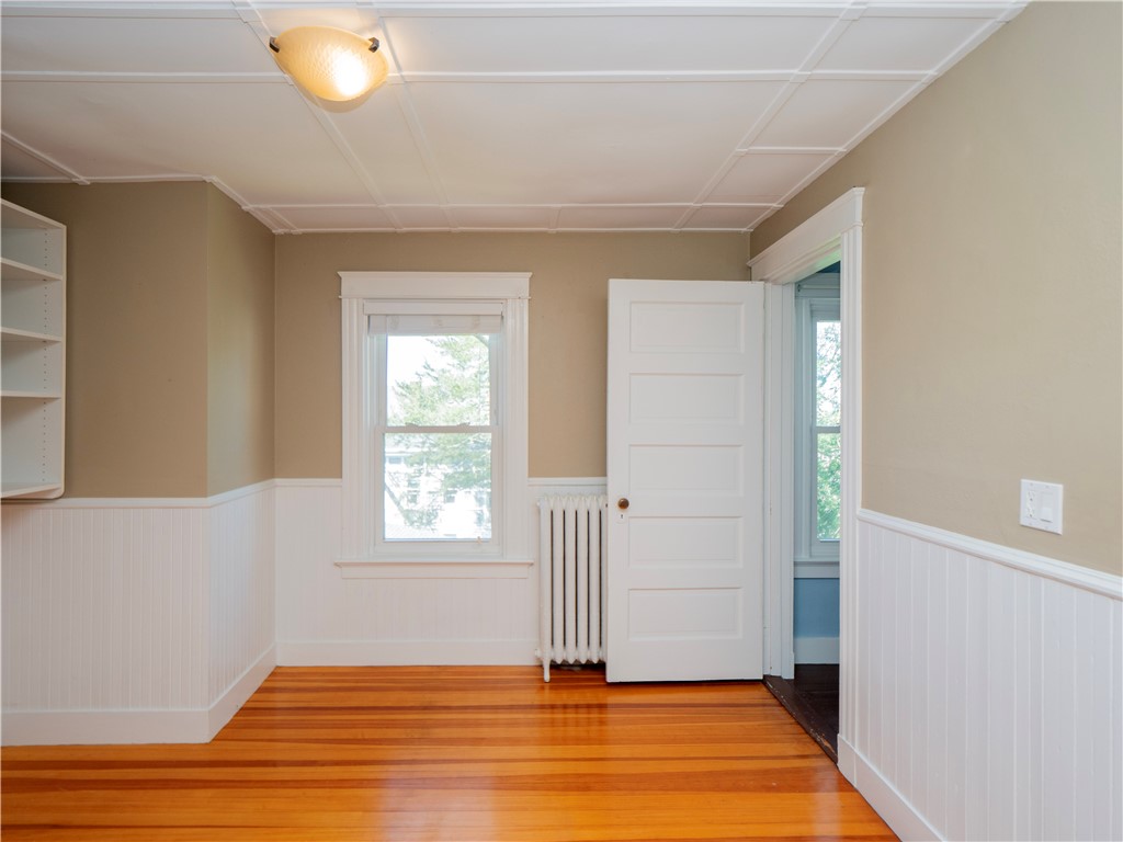 573 Spring Street Newport, RI 02840 - Photo 32 of 50 Primary Suite walk in closet dressing area with ensuite bath & door to back stairway