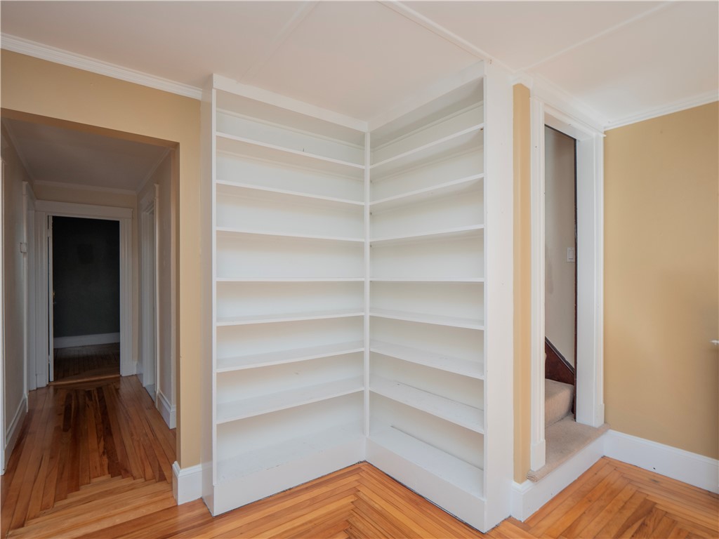 573 Spring Street Newport, RI 02840 - Photo 37 of 50 Second Floor sitting room or office view to book shelves, landing and the stairway to 3rd floor bedrooms