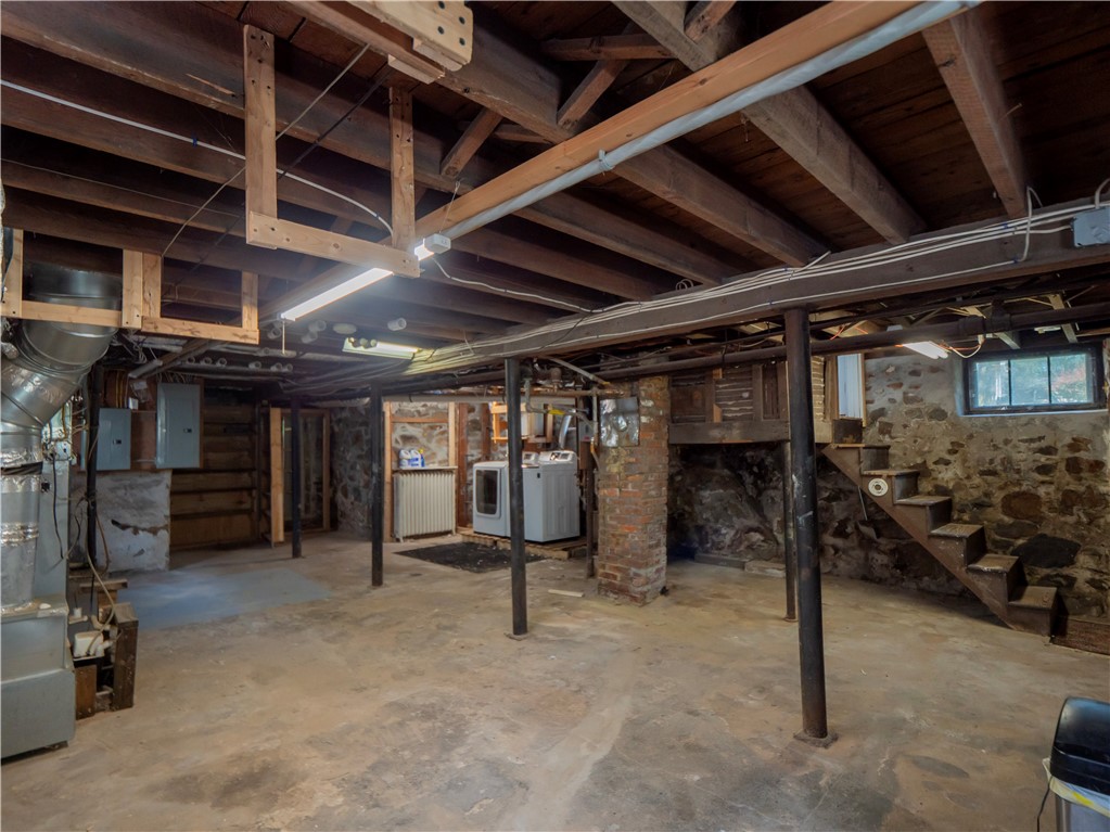 573 Spring Street Newport, RI 02840 - Photo 41 of 50 Full Basement with Laundry & view to doorway for the workshop and outside walk out.