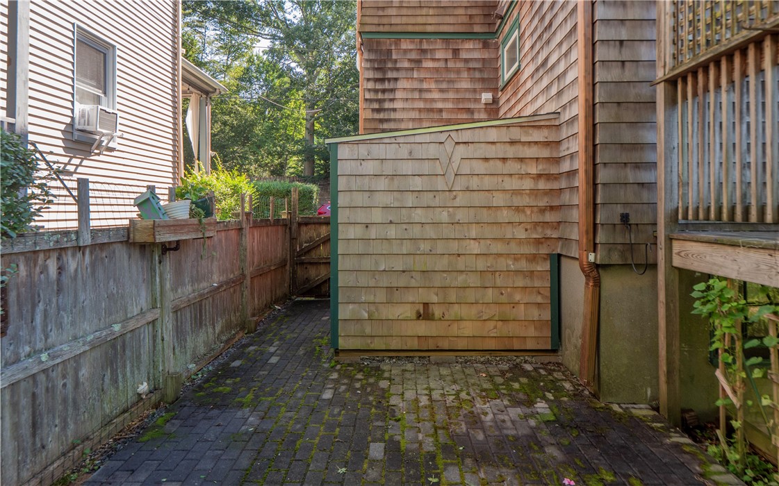 573 Spring Street Newport, RI 02840 - Photo 47 of 50 Patio & Shed , back door behind the shed plus side gate to front yard