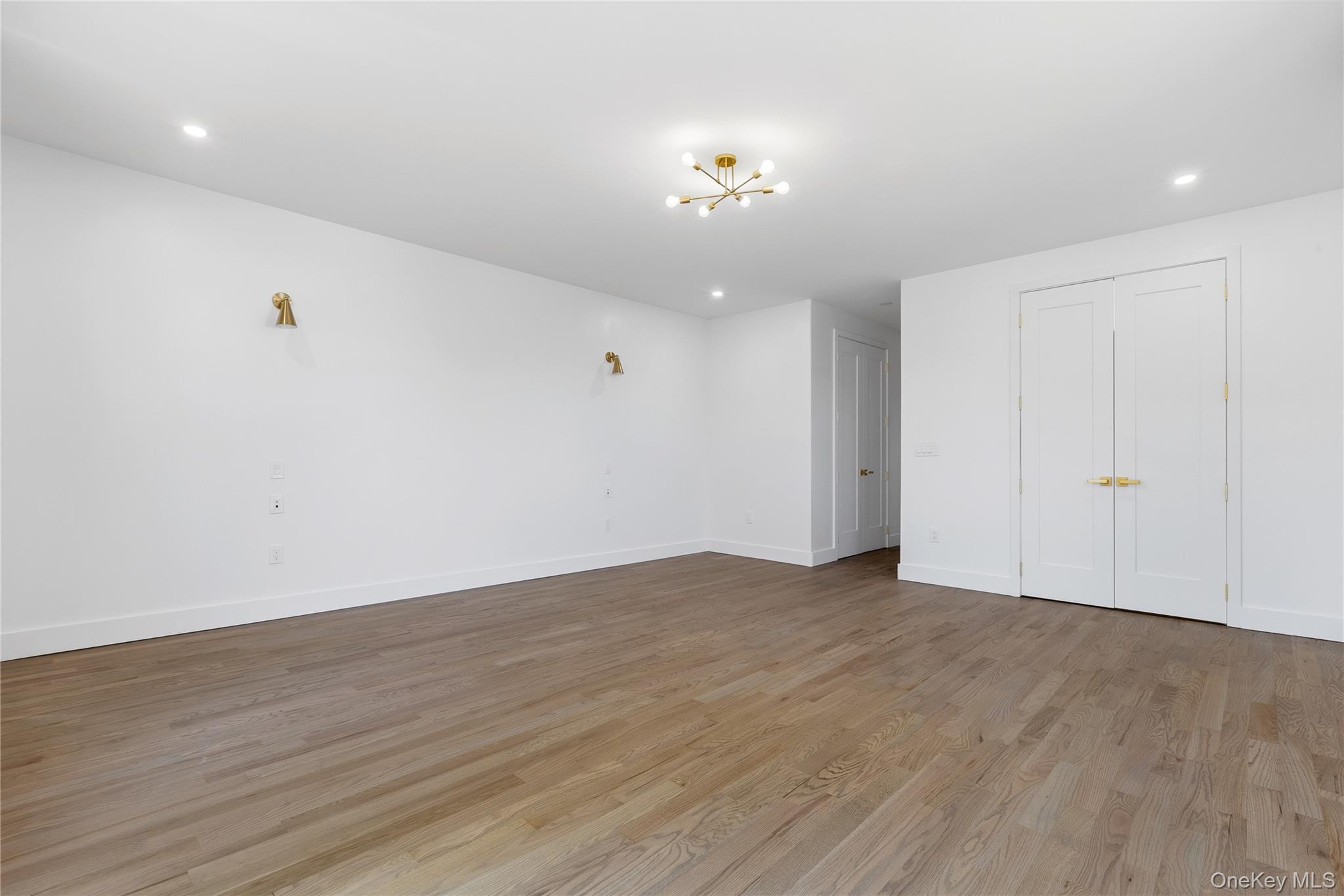 548 Lakes Road Monroe, NY 10950 - Photo 40 of 50 a view of an empty room with wooden floor