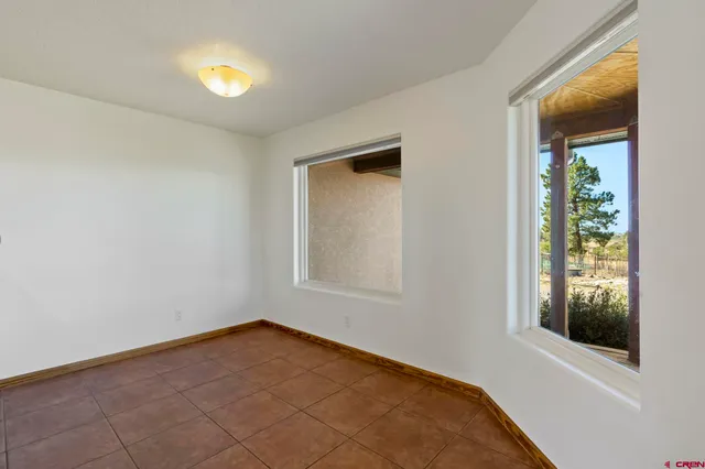 an empty room with windows