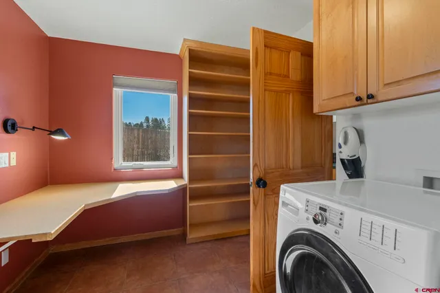 a room with a bed and furniture