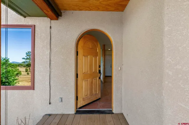 a view of front door with wooden floor