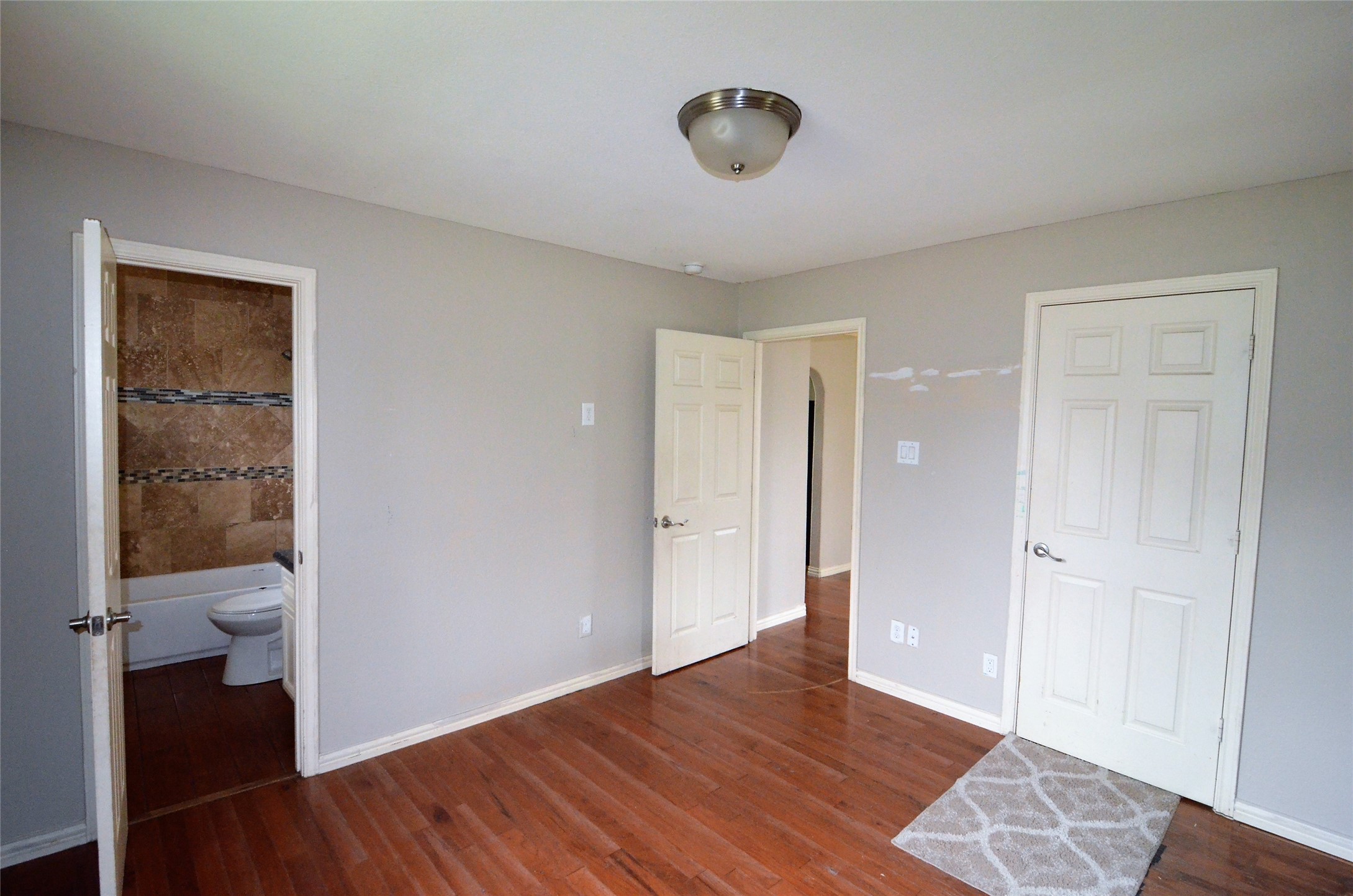 7326 Eagle Pass Street Houston, TX 77020 - Photo 12 of 26 a view of a room with wooden floor and a bathroom