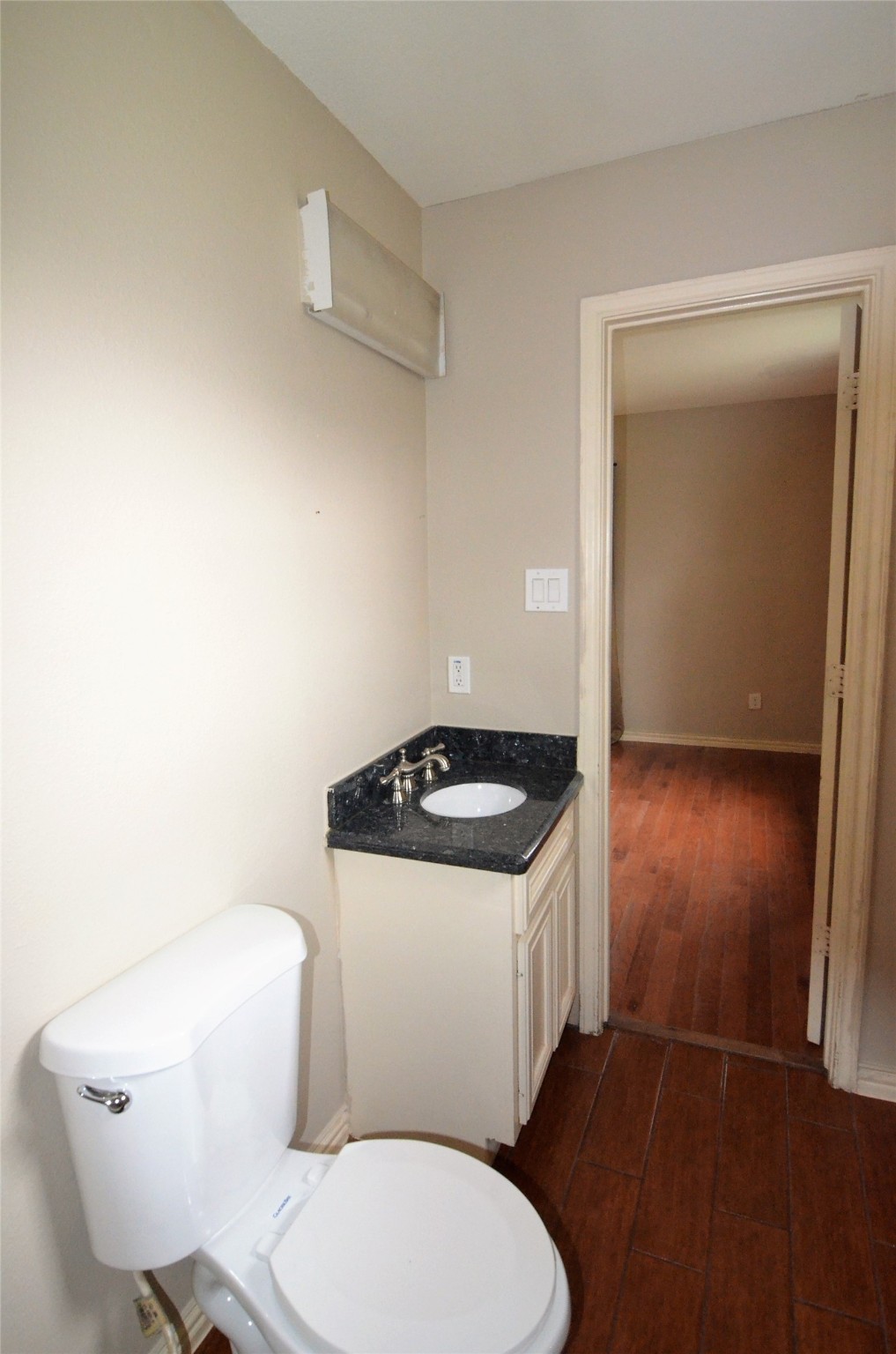 7326 Eagle Pass Street Houston, TX 77020 - Photo 16 of 26 a white toilet sitting next to a bathroom sink