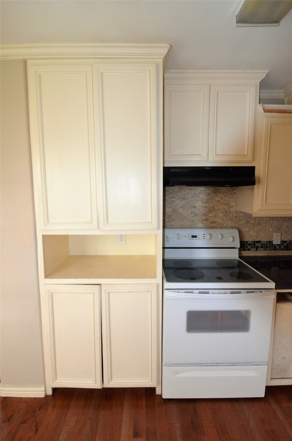 7326 Eagle Pass Street Houston, TX 77020 - Photo 19 of 26 a stove top oven sitting inside of a kitchen