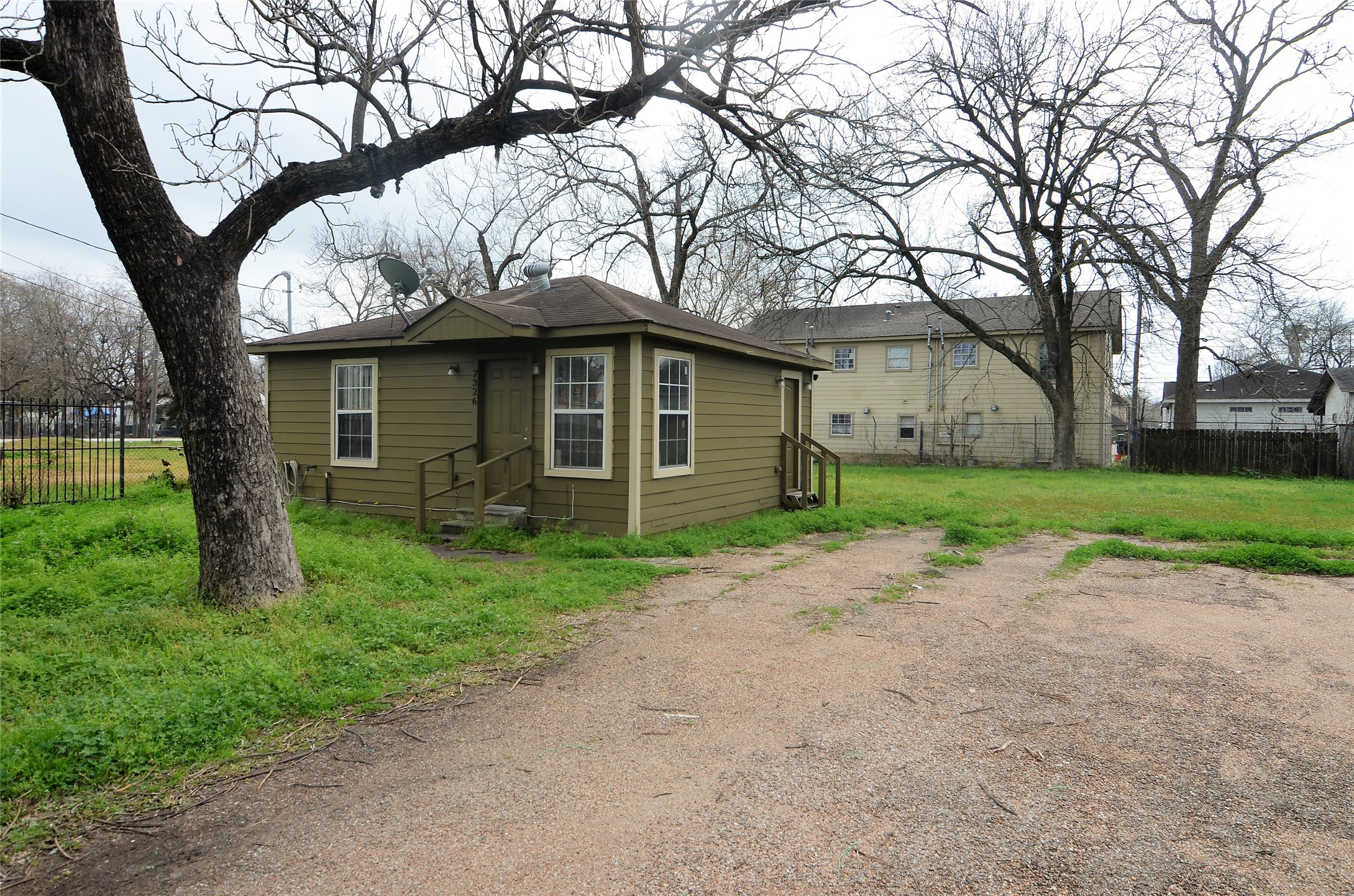 7326 Eagle Pass Street Houston, TX 77020 - Photo 4 of 26 a view of a yard with a house and a large tree