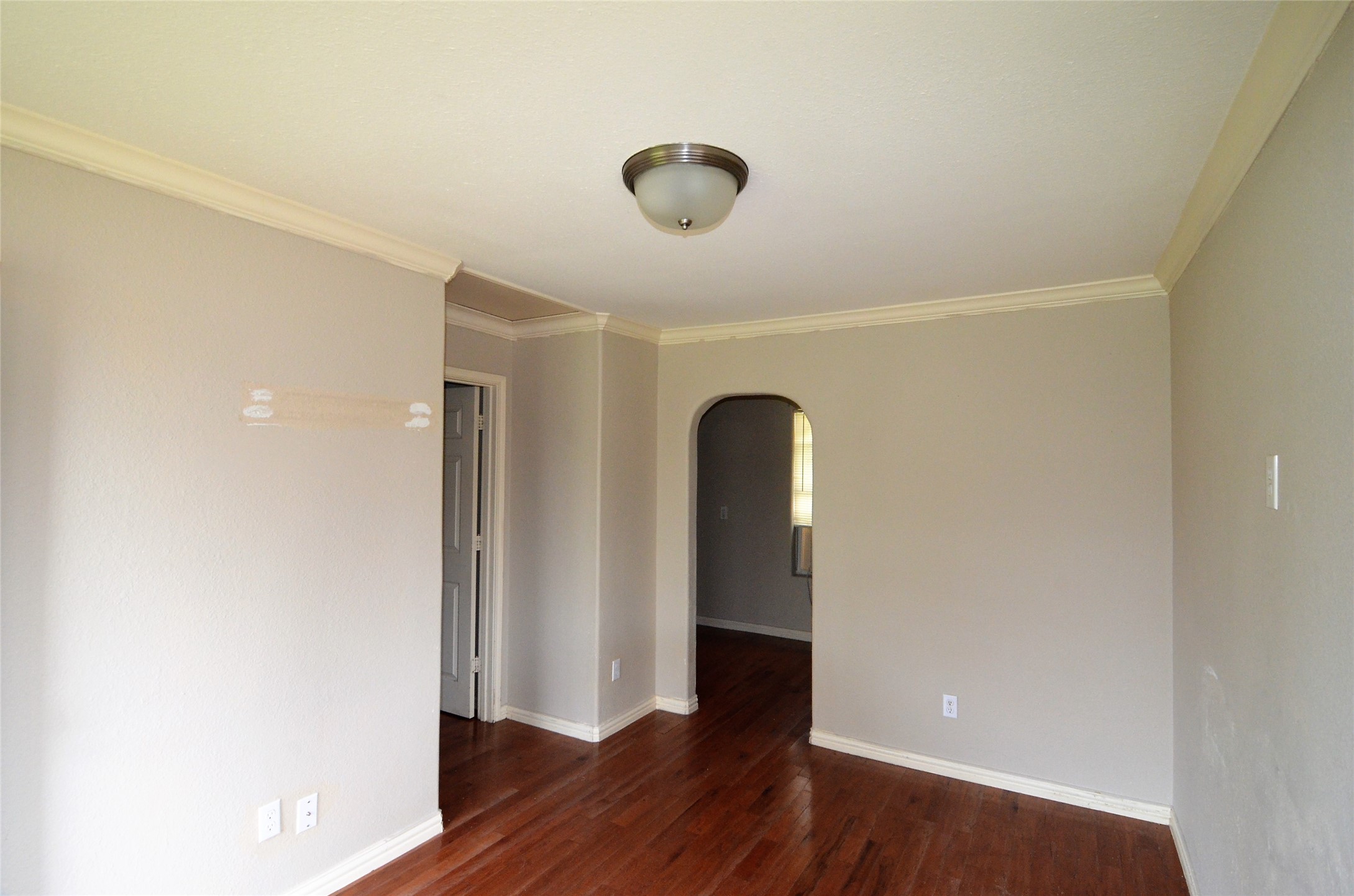 7326 Eagle Pass Street Houston, TX 77020 - Photo 7 of 26 a view of empty room with wooden floor
