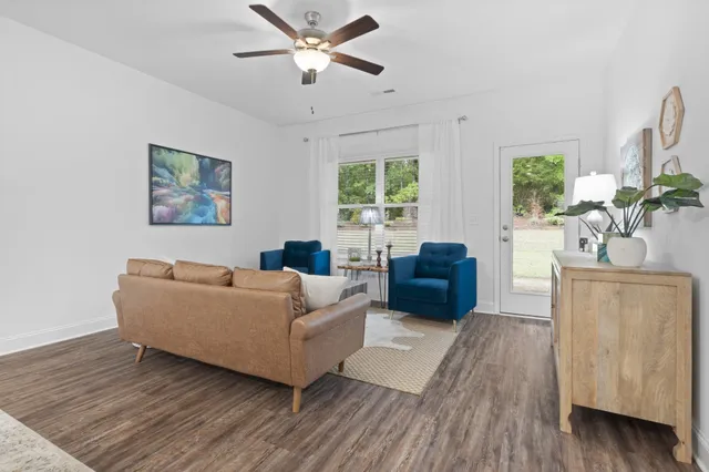 a living room with furniture and a large window