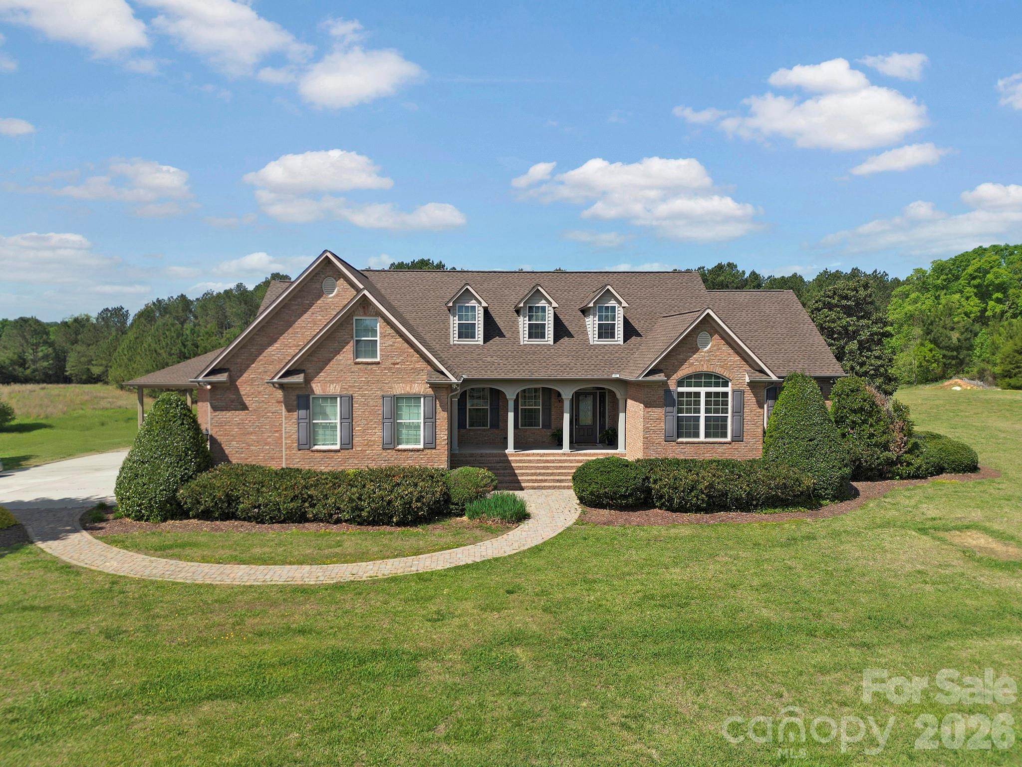 2407 Robert Usher Road Lancaster, SC 29720 - Photo 1 of 47 a front view of a house with a yard