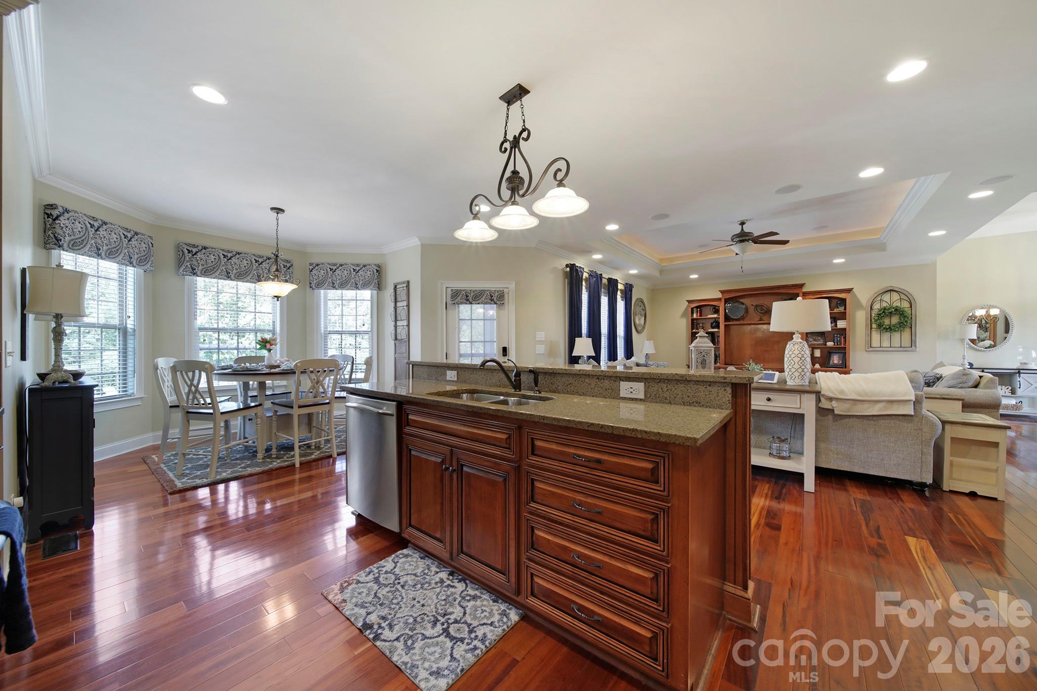 2407 Robert Usher Road Lancaster, SC 29720 - Photo 13 of 47 a large kitchen with lots of counter space dining table and stainless steel appliances