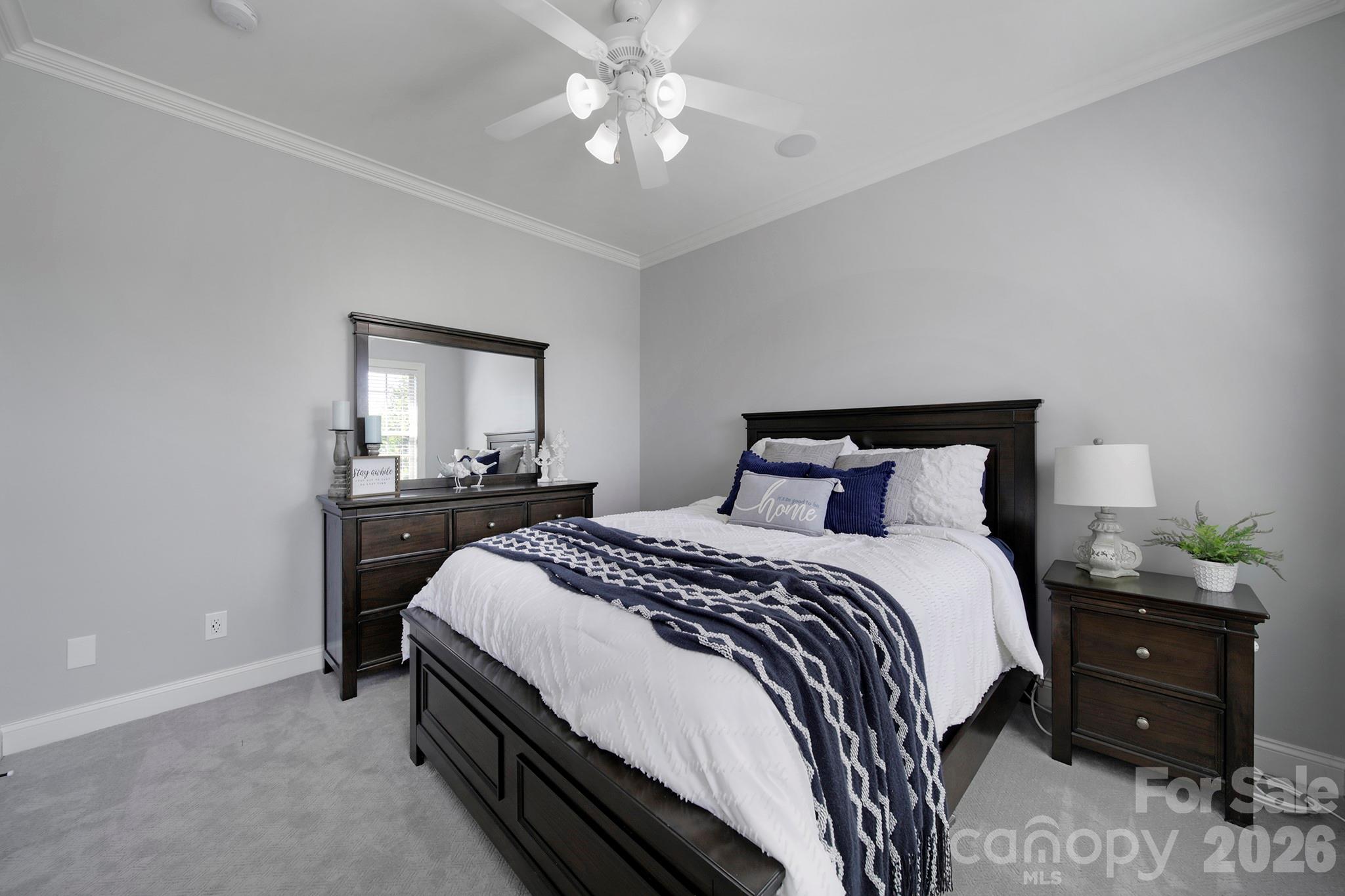 2407 Robert Usher Road Lancaster, SC 29720 - Photo 17 of 47 a bedroom with a bed and a chandelier