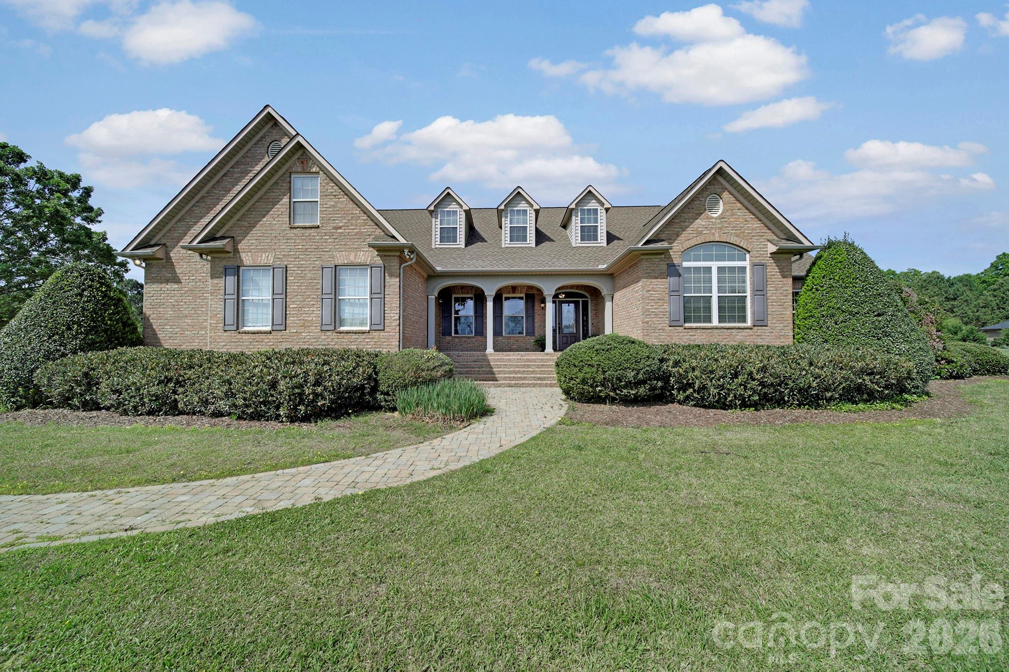 2407 Robert Usher Road Lancaster, SC 29720 - Photo 2 of 47 a front view of a house with a yard