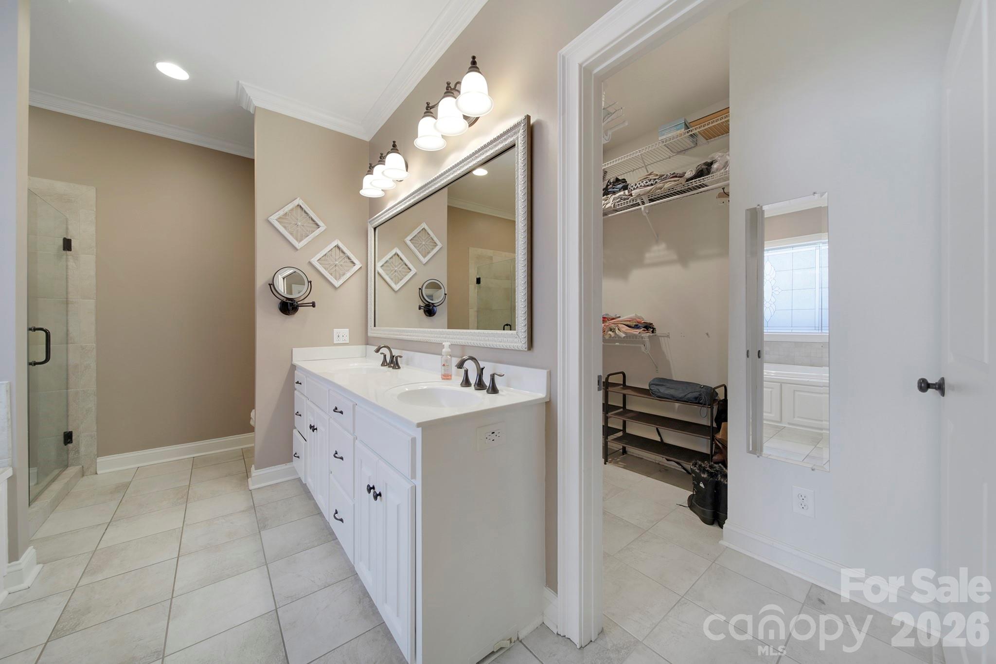 2407 Robert Usher Road Lancaster, SC 29720 - Photo 24 of 47 a spacious bathroom with a bathtub sink and mirror