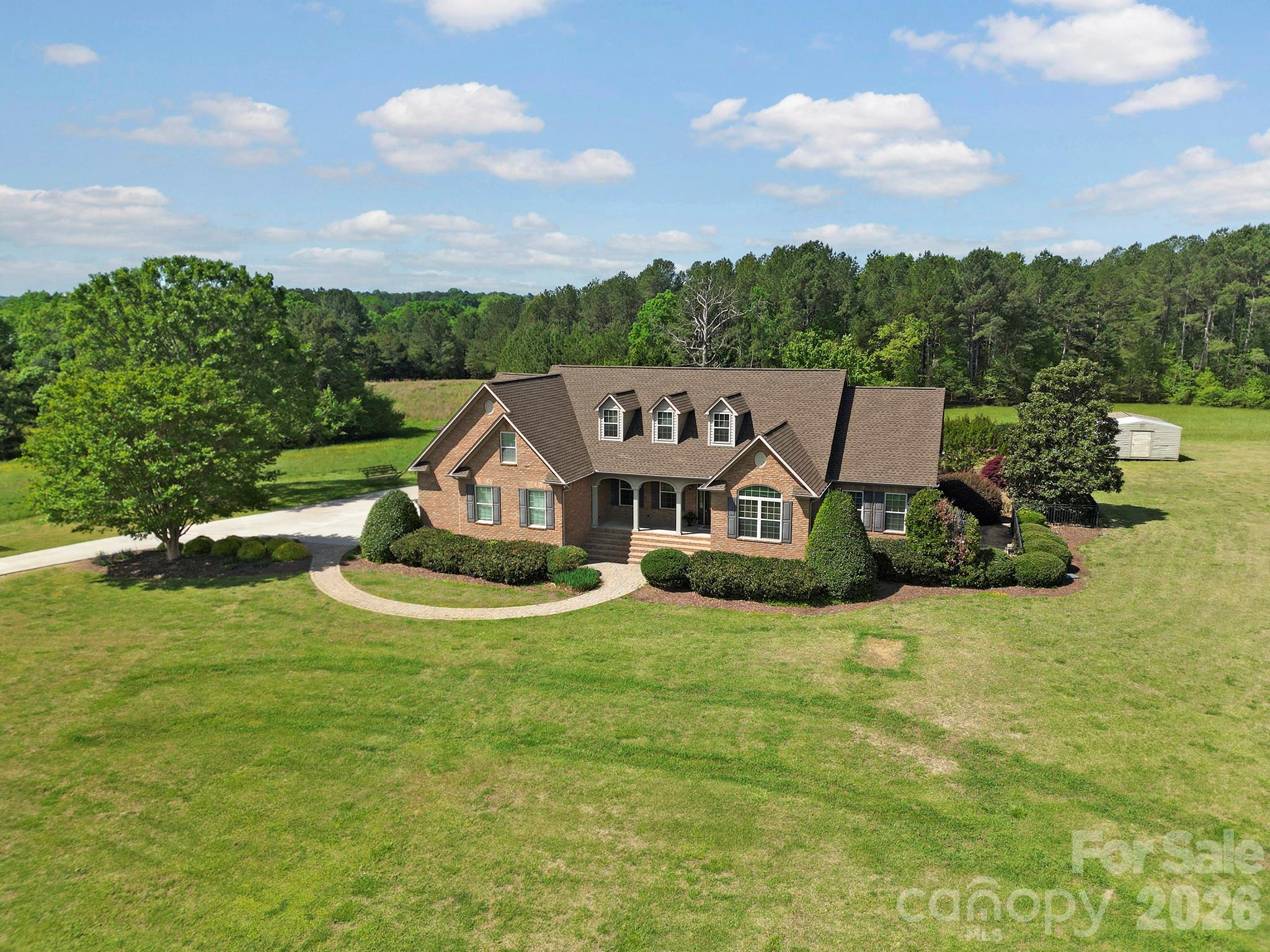 2407 Robert Usher Road Lancaster, SC 29720 - Photo 4 of 47 an aerial view of a house with a big yard and large trees