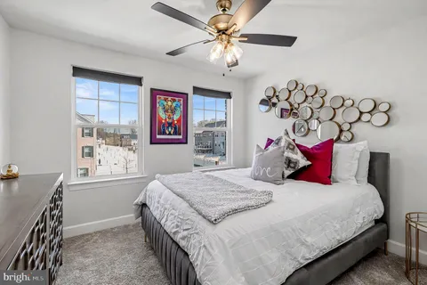 a bedroom with bed and a window