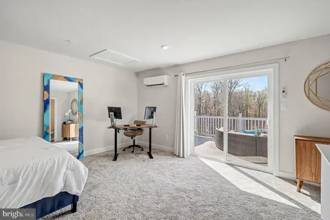 a bedroom with a bed and a view of bedroom