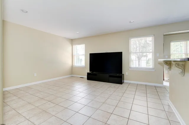a view of staircase and living room with a rug