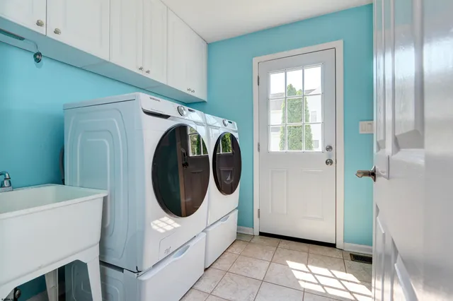 a bathroom with a sink a toilet and tub