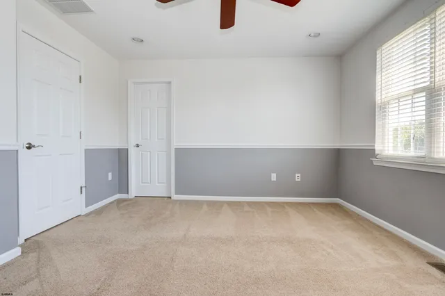 a bathroom with a shower and a window