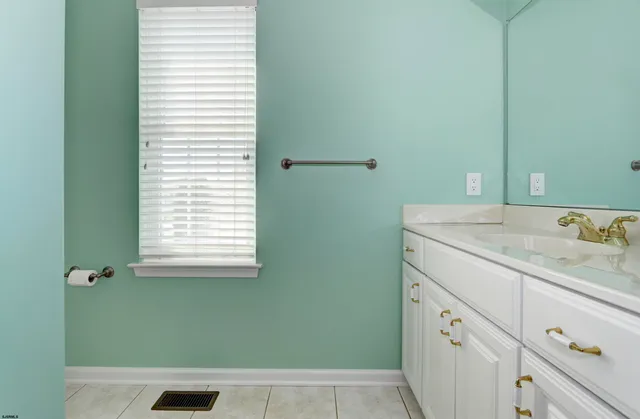 a bathroom with a bathtub and window