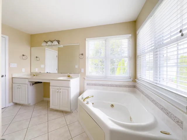 a view of a house with a yard and plants