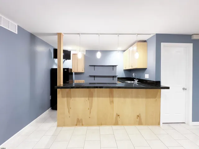 an aerial view of multiple houses with yard