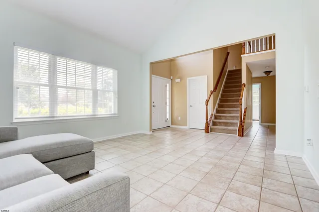 a view of a dining room with furniture and window