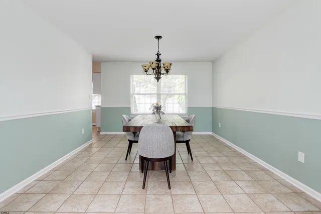 a kitchen with stainless steel appliances a stove a sink island and a refrigerator