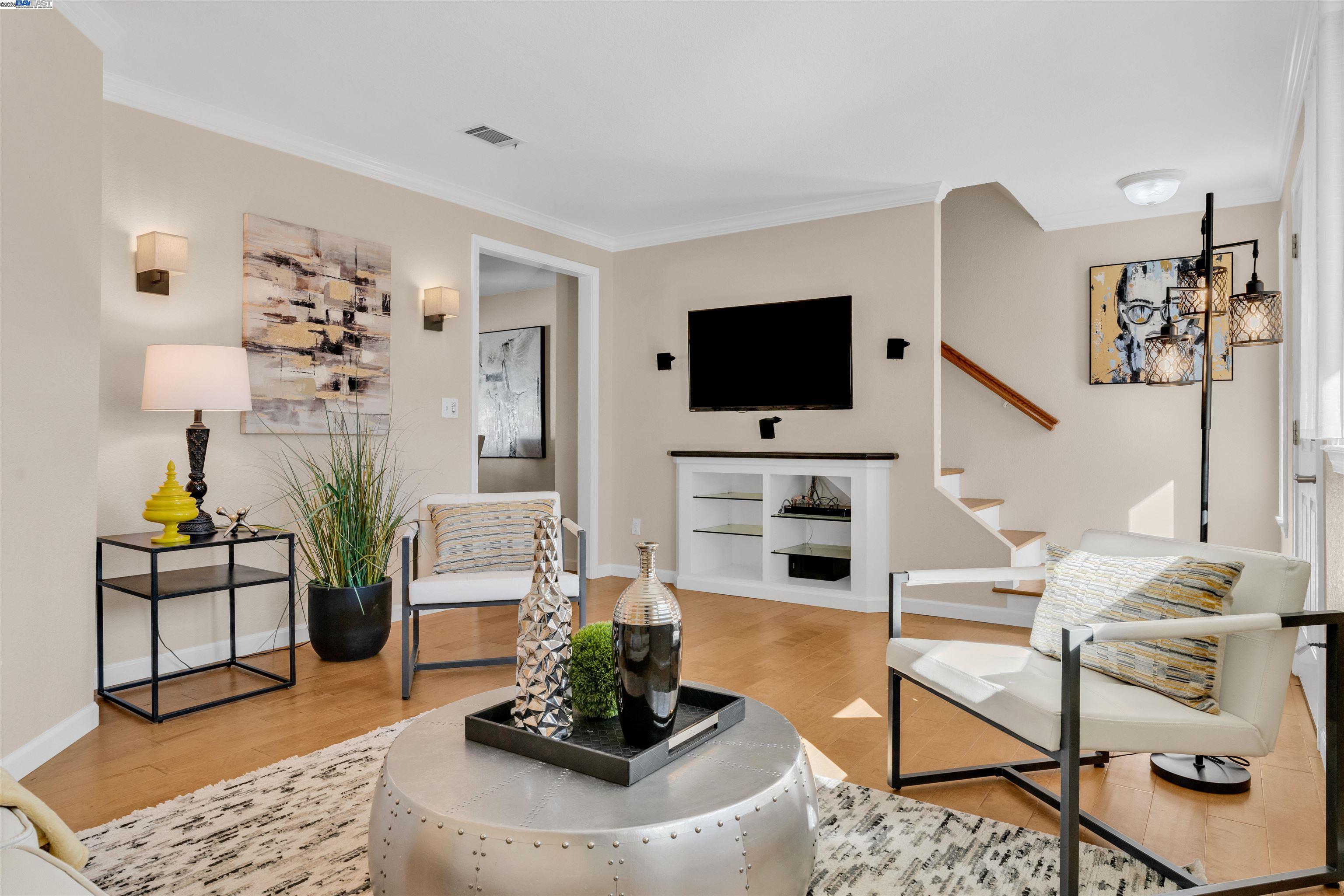 7602 Arbor Creek Circle Dublin, CA 94568 - Photo 1 of 47 a living room with furniture and a flat screen tv